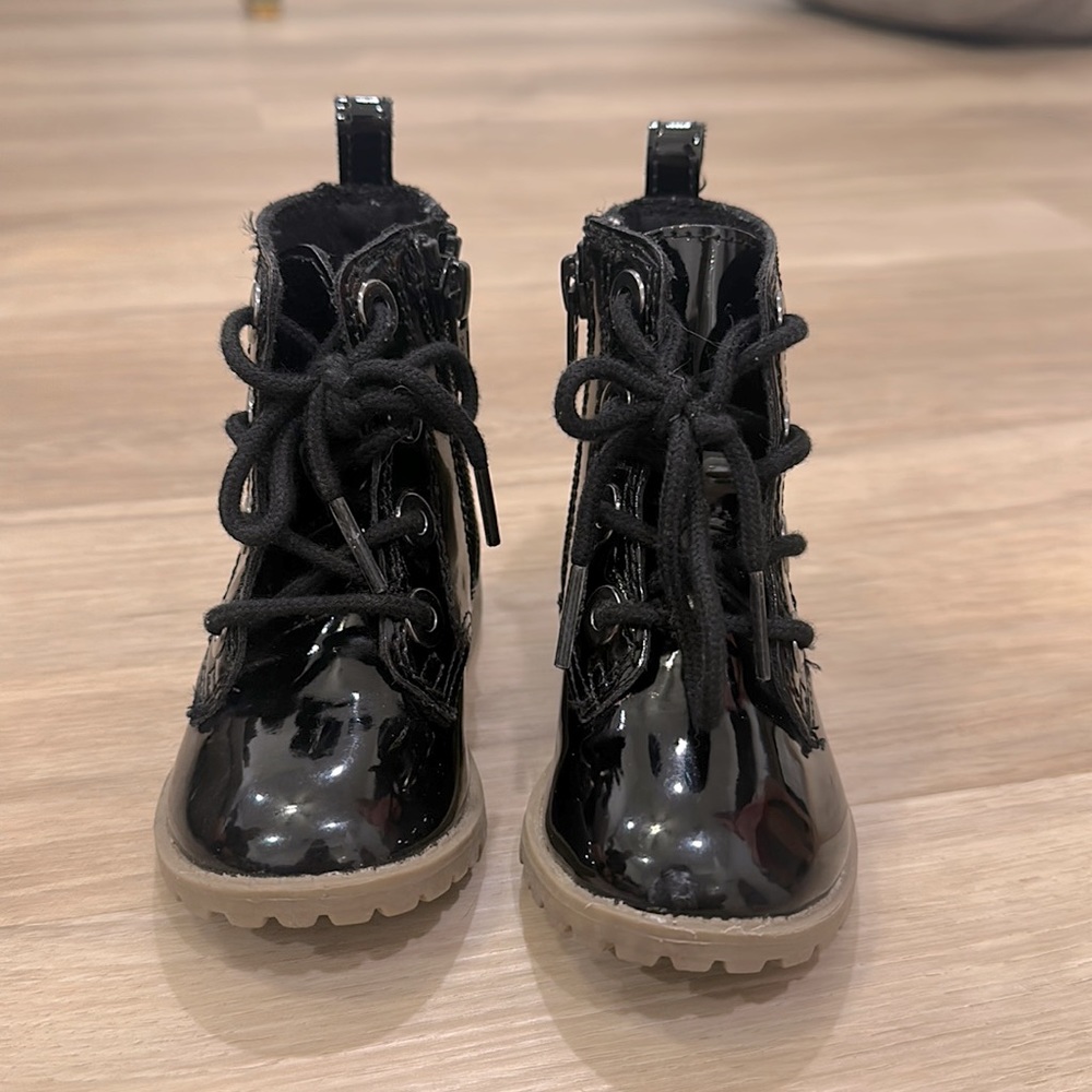 Shiny faux leather lace up boot.